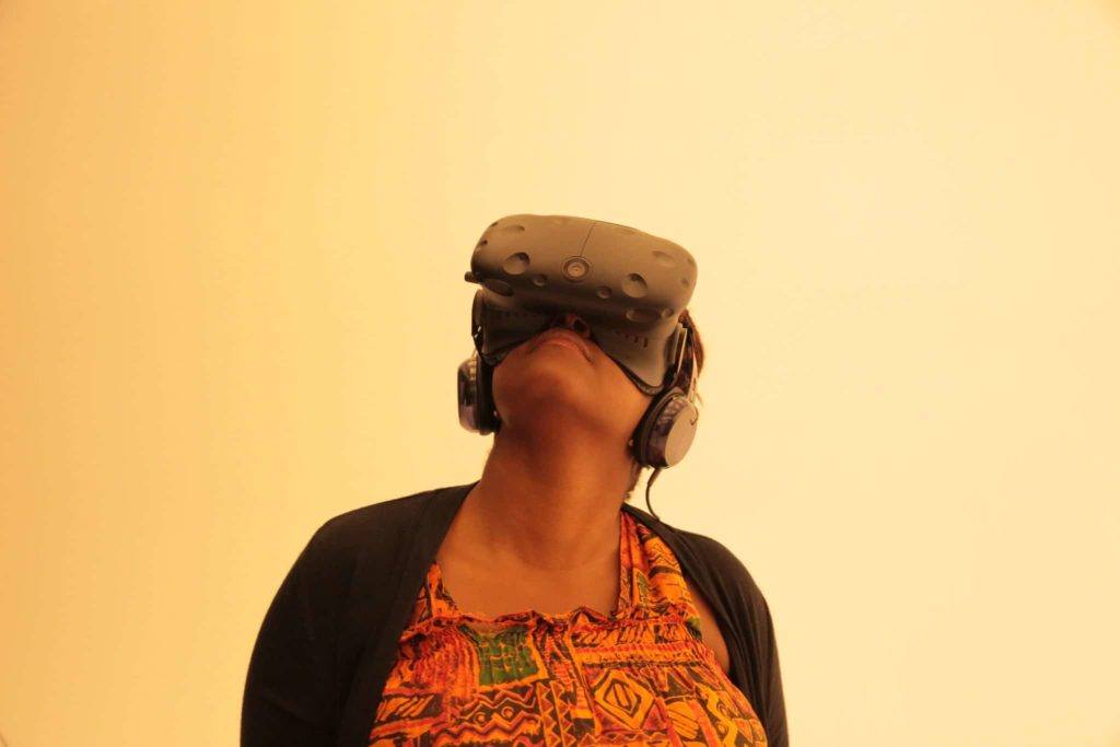 CoderZ Virtual Robotics How we teach Woman with virtual reality headset