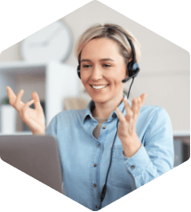 Female computer science teacher sitting at computer and participating in a training webinar